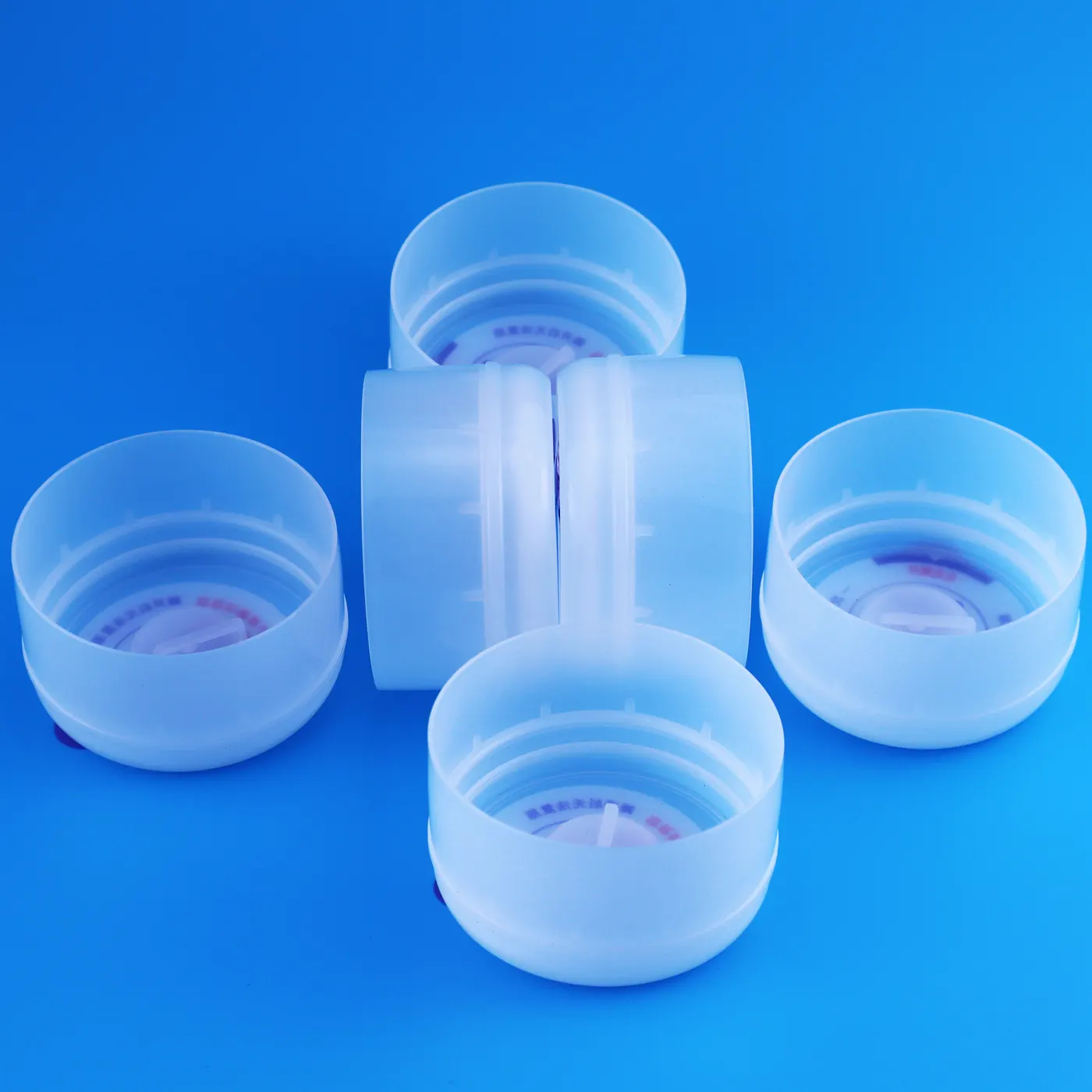 Photo of one time use 5 gallon water bottle cap assortment