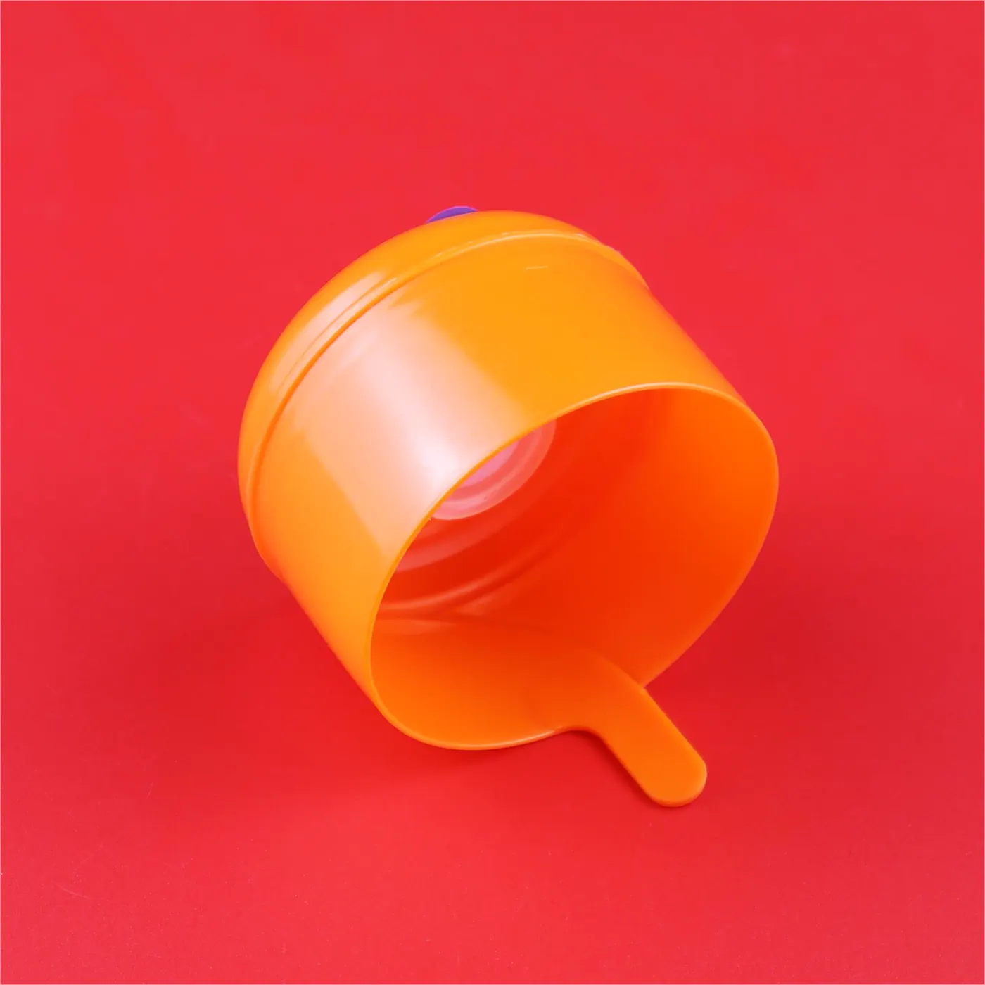 Photo of Orange bottle cap sealing leak proof